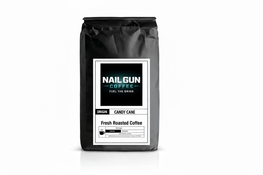 Nail Gun Coffee in a black bag on white background with Candy Cane flavored coffee beans