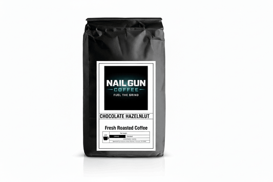 Nail Gun Coffee in a black bag on white background with Chocolate Hazelnut flavored coffee beans 