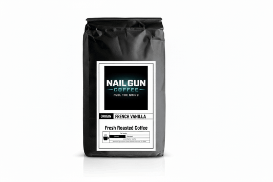 Nail Gun Coffee in a black bag on white background with French Vanilla flavored coffee beans