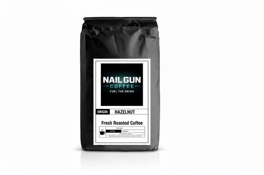 Nail Gun Coffee in a black bag on white background with Hazelnut flavored coffee beans 