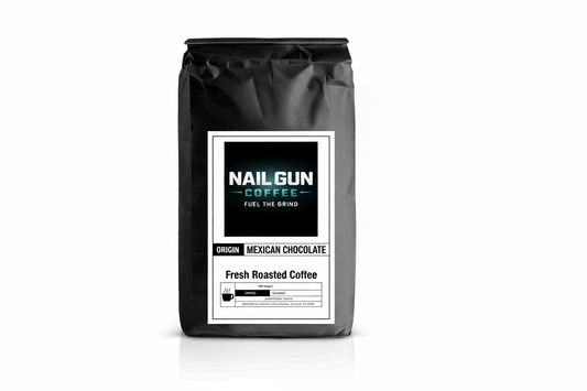 Nail Gun Coffee in a black bag on white background with Mexican Chocolate flavored coffee beans 