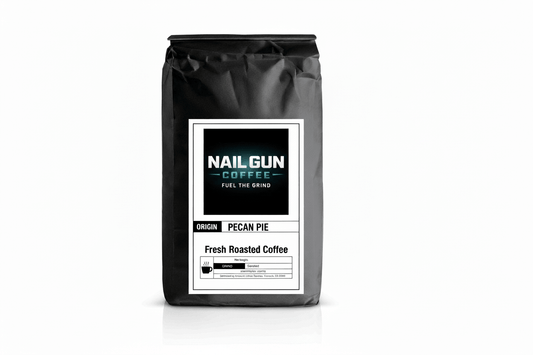 Nail Gun Coffee in a black bag on white background with Pecan Pie flavored coffee beans