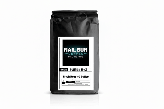 Nail Gun Coffee in a black bag on white background with Pumpkin Spice flavored coffee beans